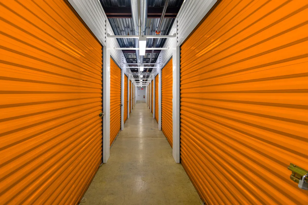 Storage unit hall with orange doors